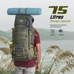 Person wearing TRIUMPH_X-75_Rucksack_-_Hunter-Green Backpack in rugged terrain, emphasizing style, durability, and functionality for outdoor adventures.