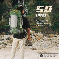 Person wearing WILDQUEST-50 Rucksack - HUNTER GREEN Backpack in rugged terrain, emphasizing style, durability, and functionality for outdoor adventures.