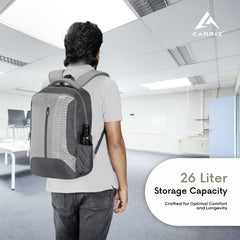 Detailed view of the storage compartments in the CPB01 26L Laptop Backpack in grey. The backpack features a roomy main compartment with a padded laptop sleeve designed to securely hold most 15-inch laptops. It includes a front zippered pocket for quick access to essentials, side mesh pockets for water bottles, and additional interior pockets for organizing smaller items like pens and a phone.